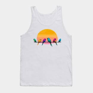 A design featuring a group of colorful birds perched on a wire, with a sunset or sunrise in the background. Tank Top